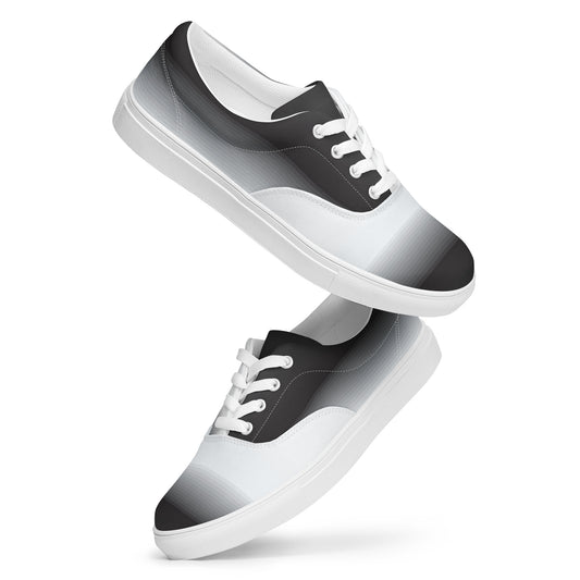 Floating view of women’s lace-up canvas shoes with black to
white gradient pattern and white sole