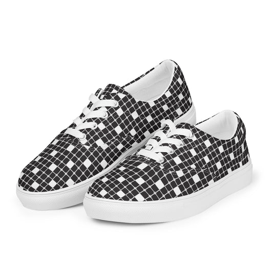 Women’s lace-up canvas shoes with monochrome grid design, white laces, and white sole, angled side view