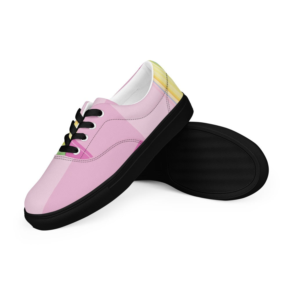women’s lace-up canvas shoes in soft pink with diagonal pastel stripe detail and black sole pair