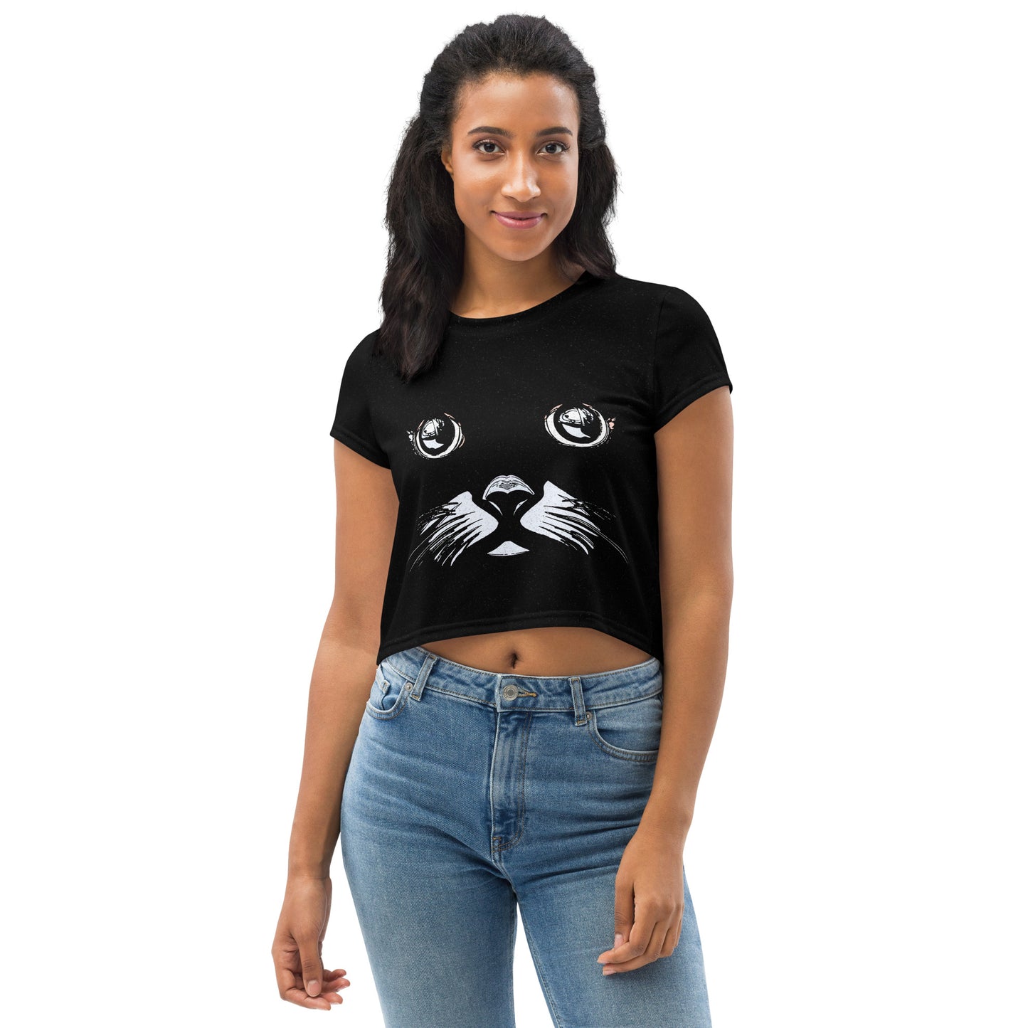 Woman wearing a black crop T-shirt with funny cat face graphic and large white cat eyes