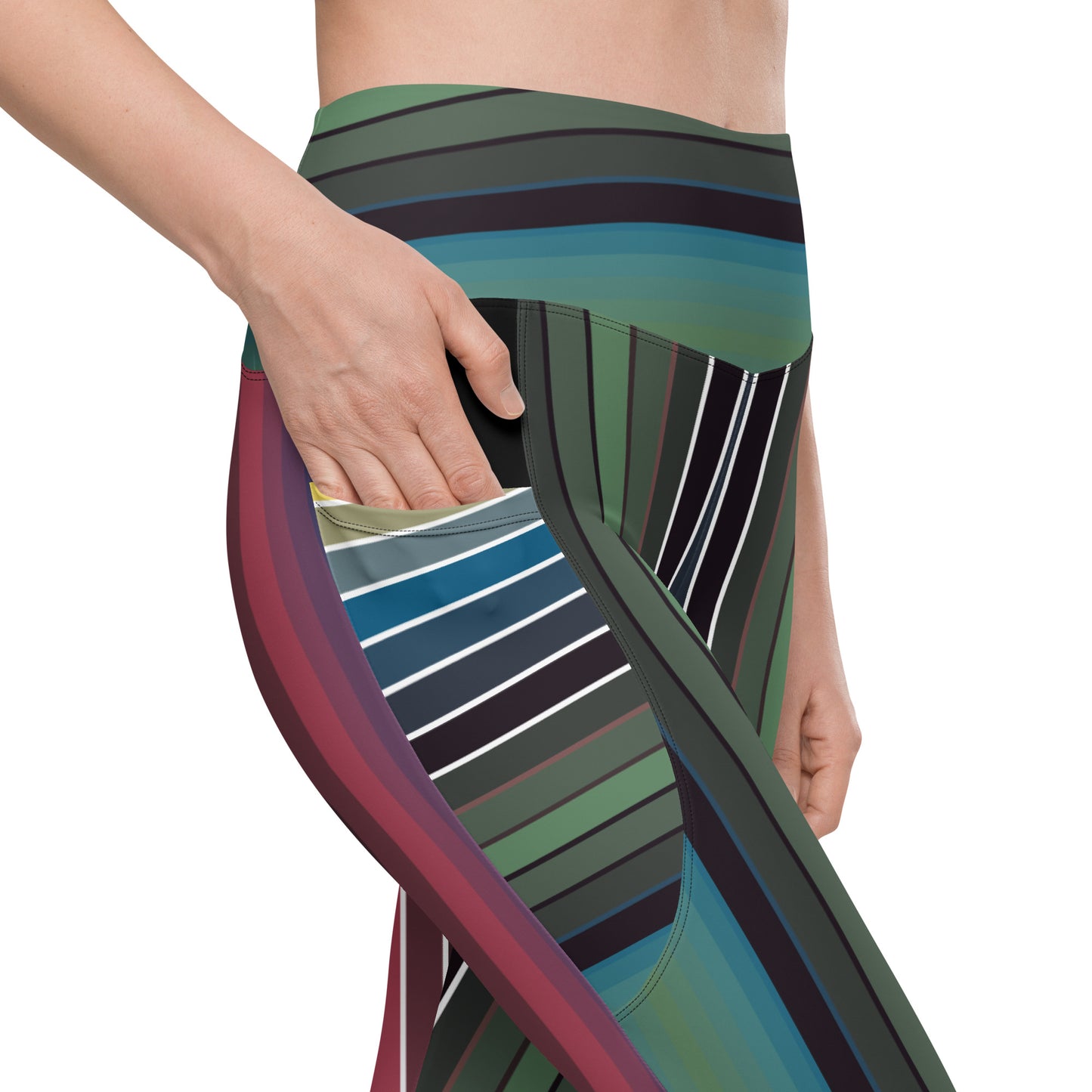 Close-up of striped leggings with side pocket showing curved green teal blue burgundy and black pattern