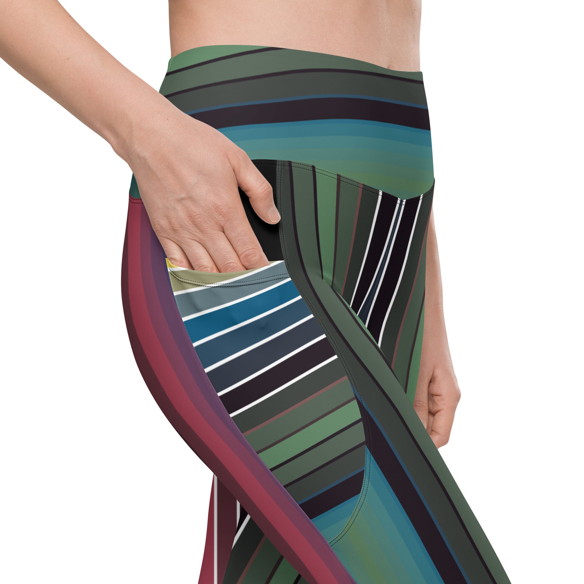 Close-up of striped leggings with side pocket showing curved green teal blue burgundy and black pattern