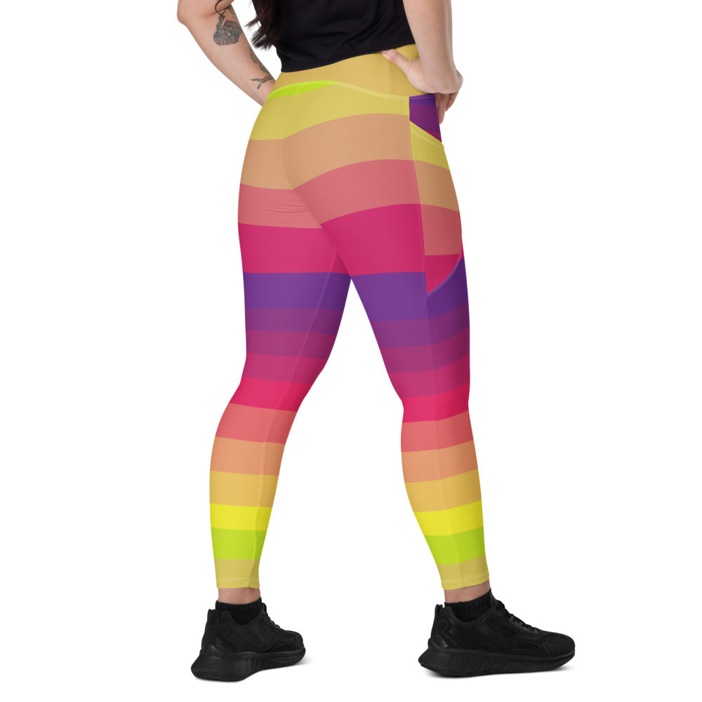 Back view of woman wearing multicolor sunset striped leggings with pockets and high-rise waistband