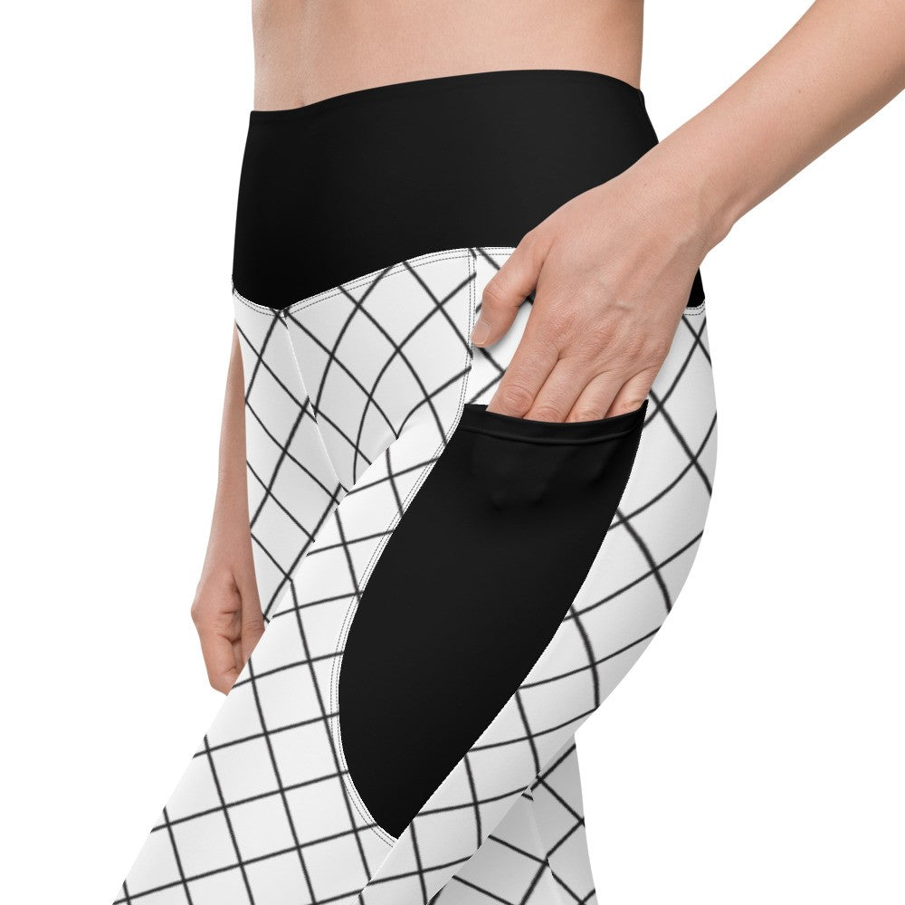 Close-up of women's geometric grid leggings showing black side pocket and high-rise waistband