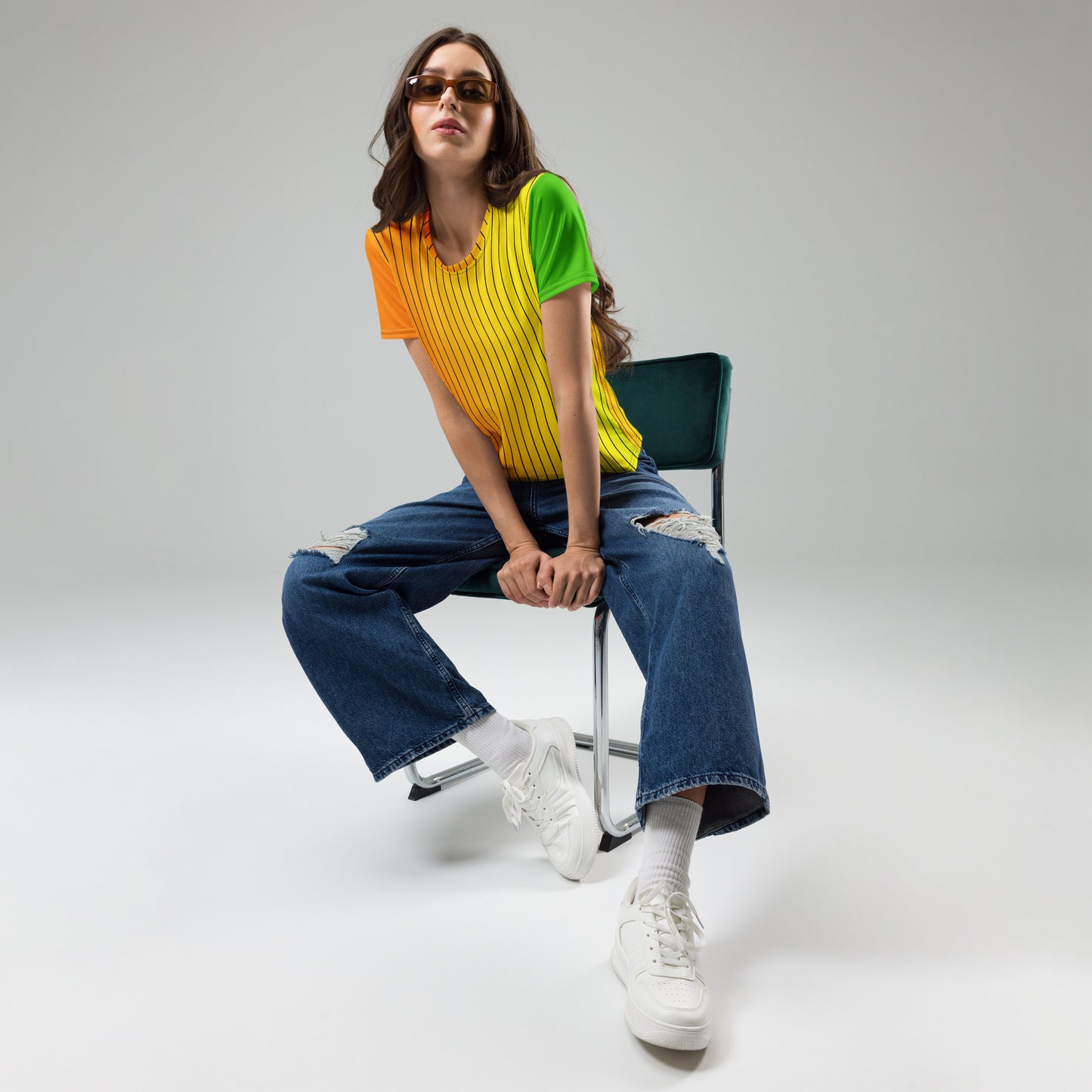 Woman styling colorful striped crew neck T-shirt with wide-leg jeans