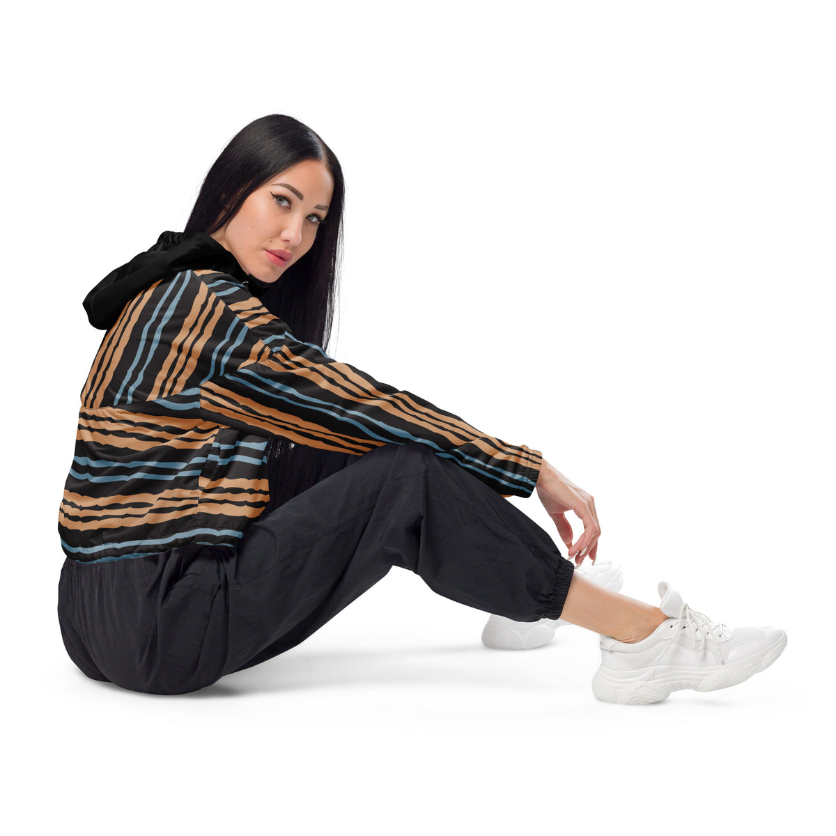 Woman wearing retro brown blue and black striped women's cropped windbreaker side view
