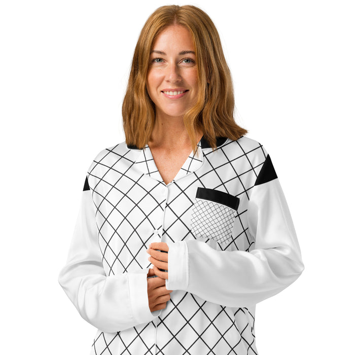 Woman wearing black and white geometric grid women's long sleeve pajama top with chest pocket