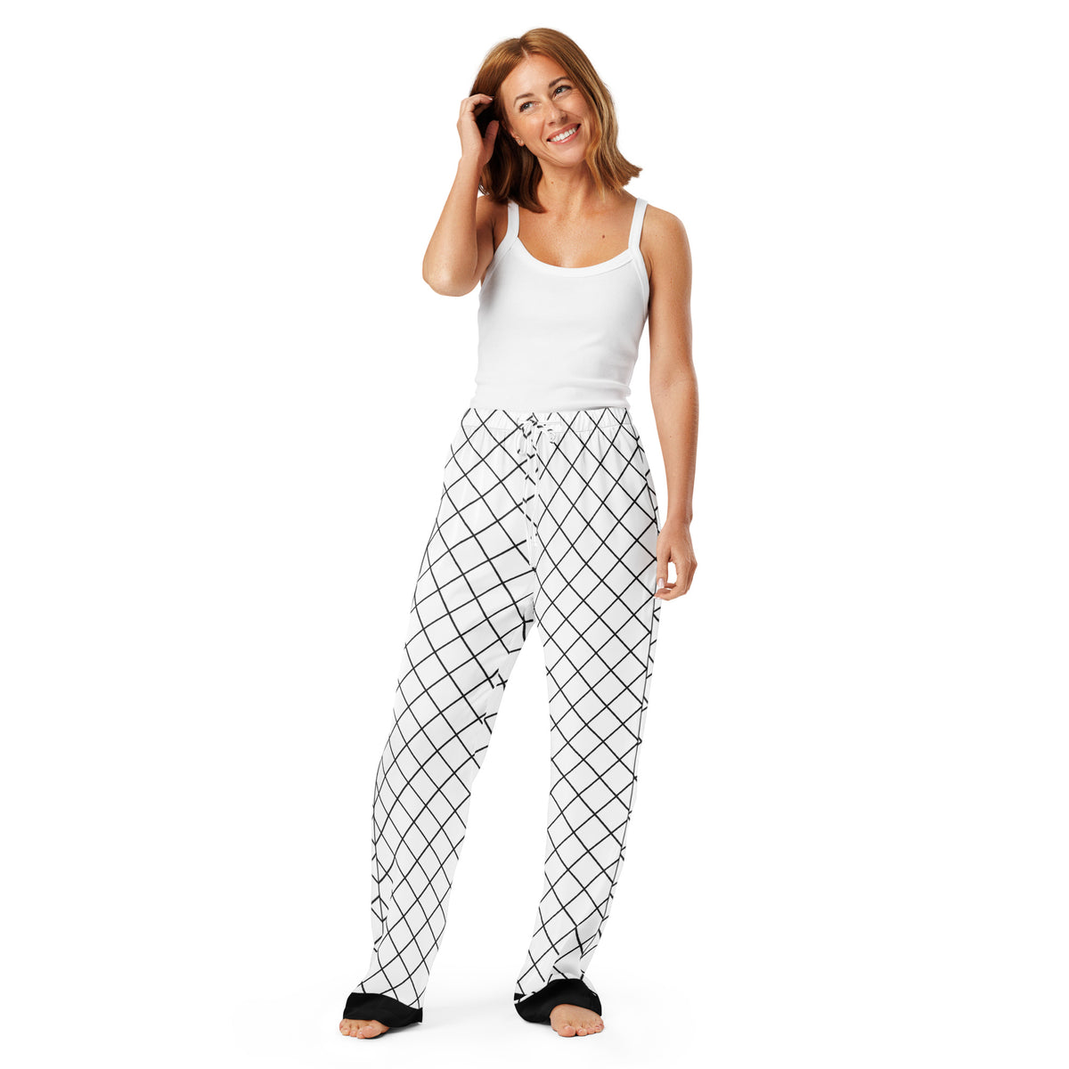 Product Woman wearing black and white grid women's pajama pants with black ankle trimmockup
