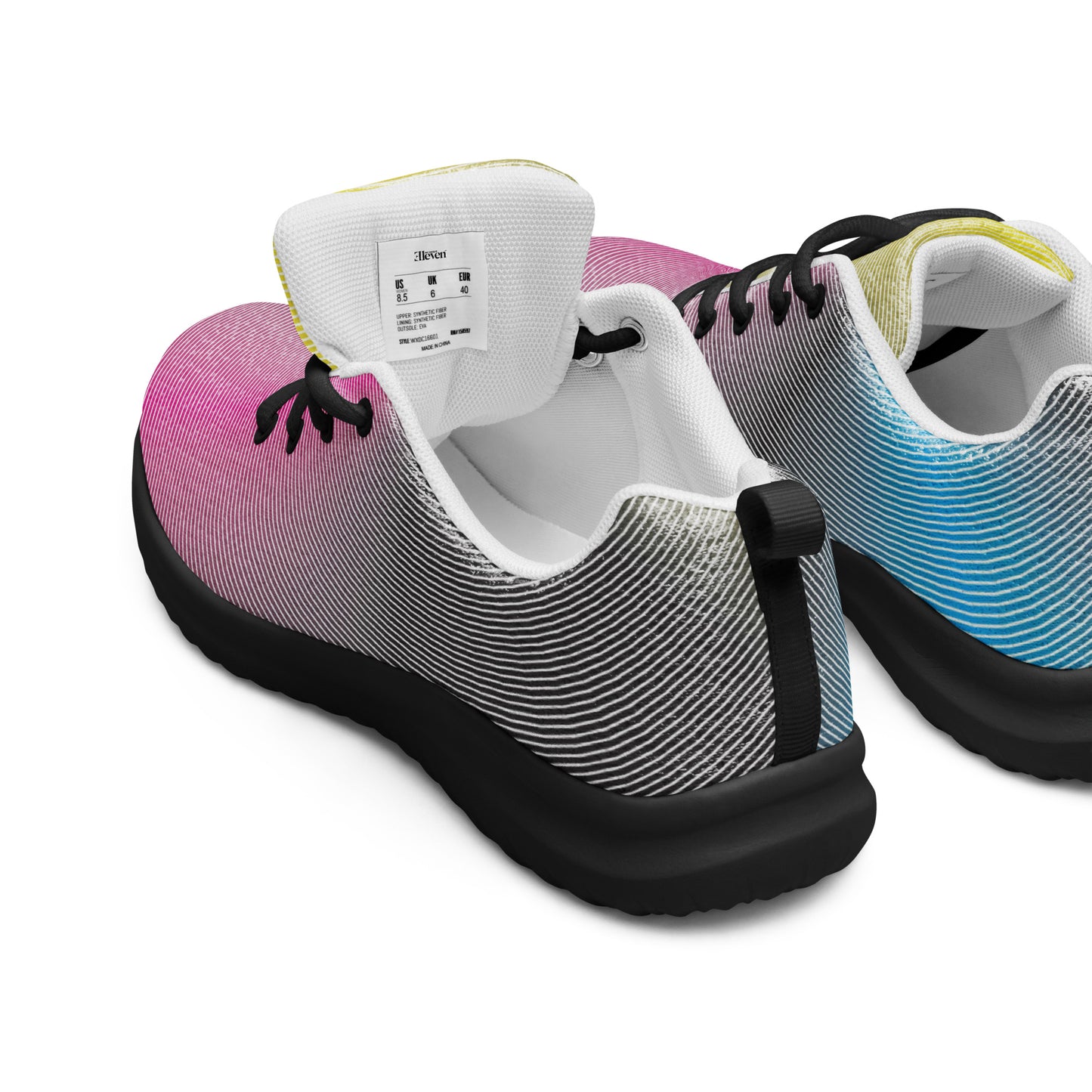 Back view of women’s athletic shoes with black sole and flowing fine line gradient pattern