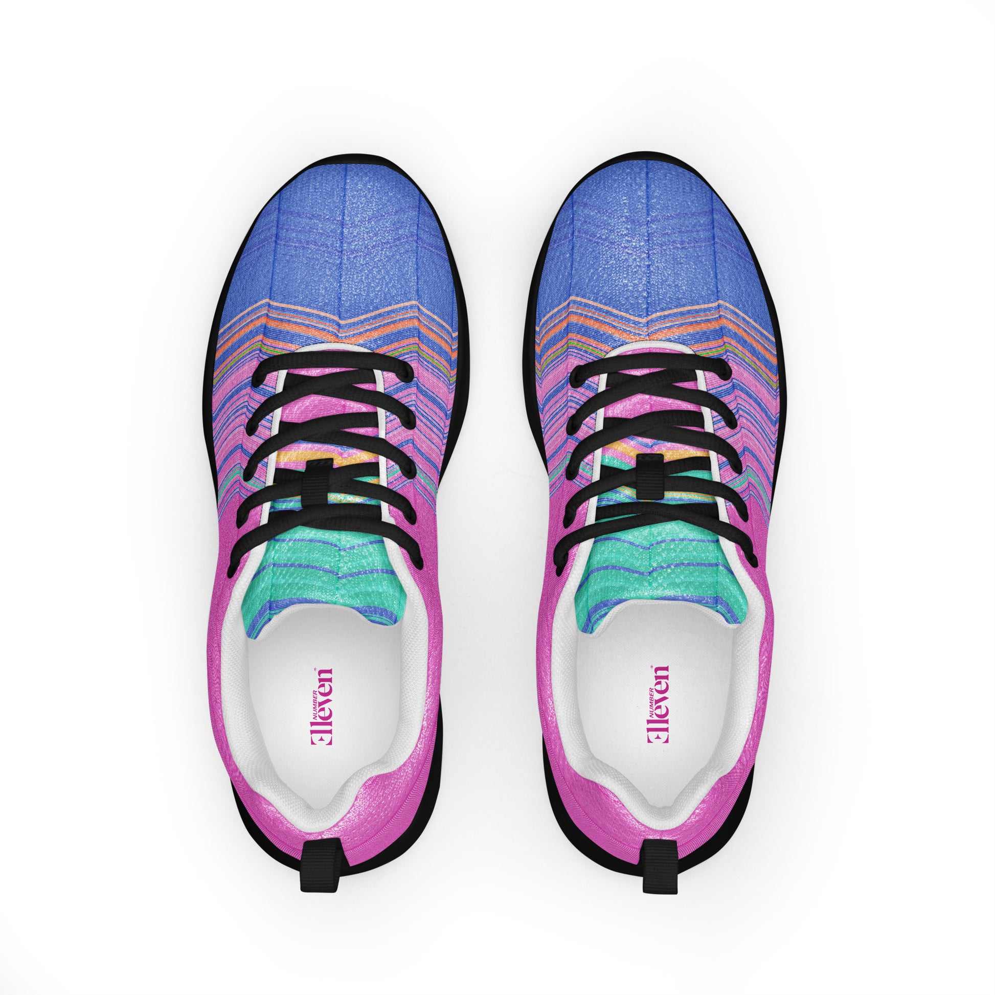 Top view of women’s athletic shoes with black laces, pink side panels, blue toe area, and turquoise tongue detail