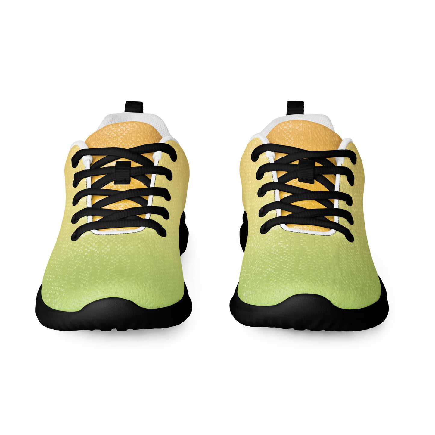 Front view of women’s athletic shoes with light green toe, pale yellow tongue, black laces, and black sole