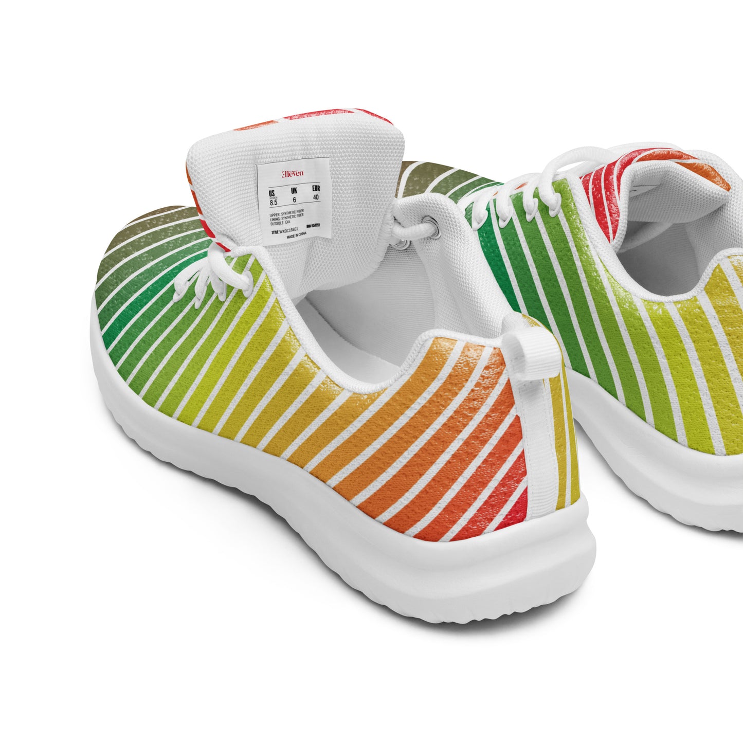 rear angled view of women’s athletic shoes with flowing white lines and green to orange gradient on white sole