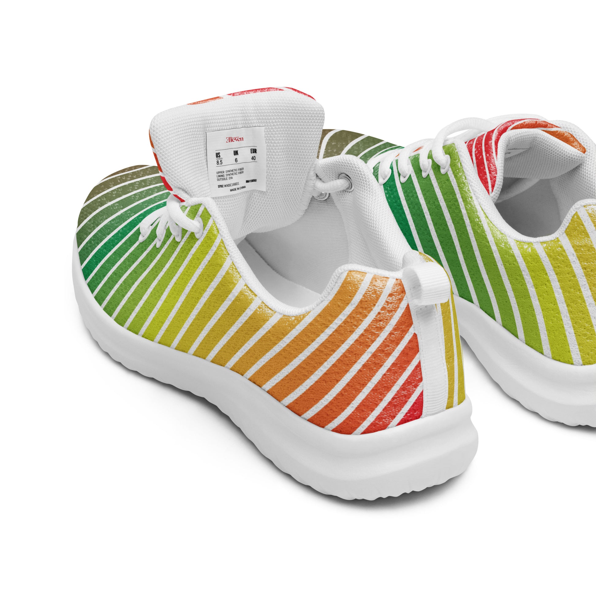 rear angled view of women’s athletic shoes with flowing white lines and green to orange gradient on white sole