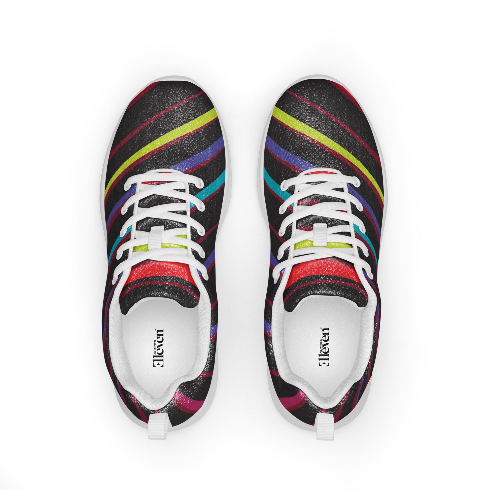 Top view of women’s athletic shoes with white laces and dark textured pattern crossed by colorful curved stripes