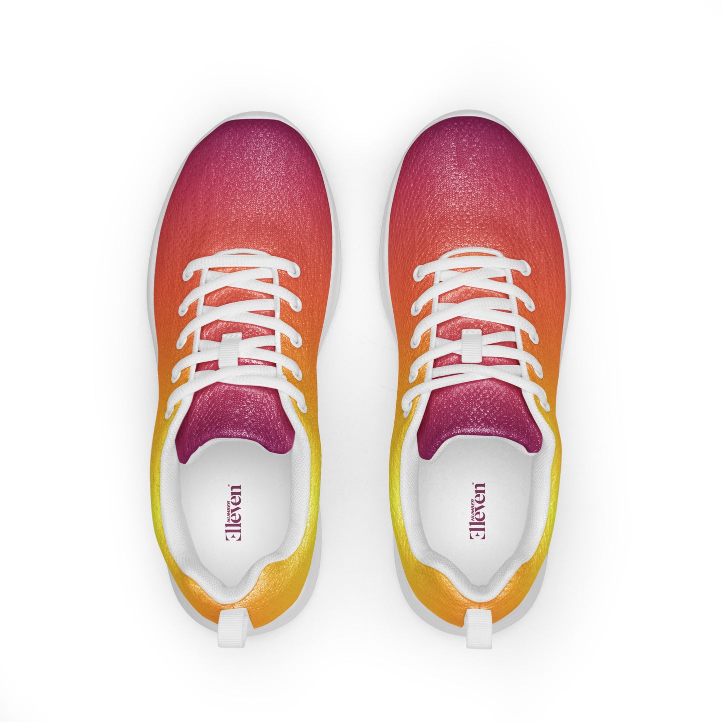 Top view of women’s athletic shoes with smooth yellow, orange, and magenta gradient design and white laces