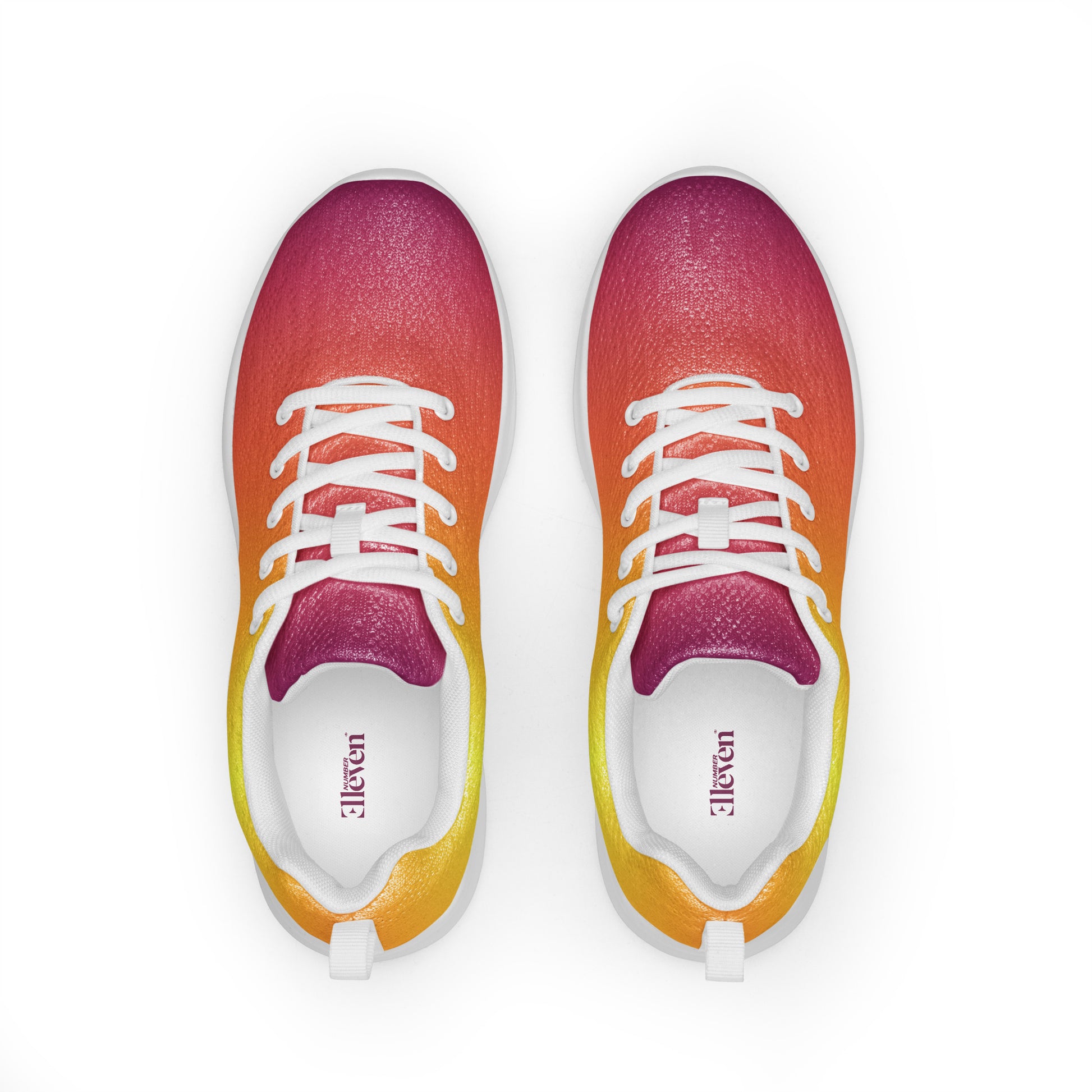Top view of women’s athletic shoes with smooth yellow, orange, and magenta gradient design and white laces
