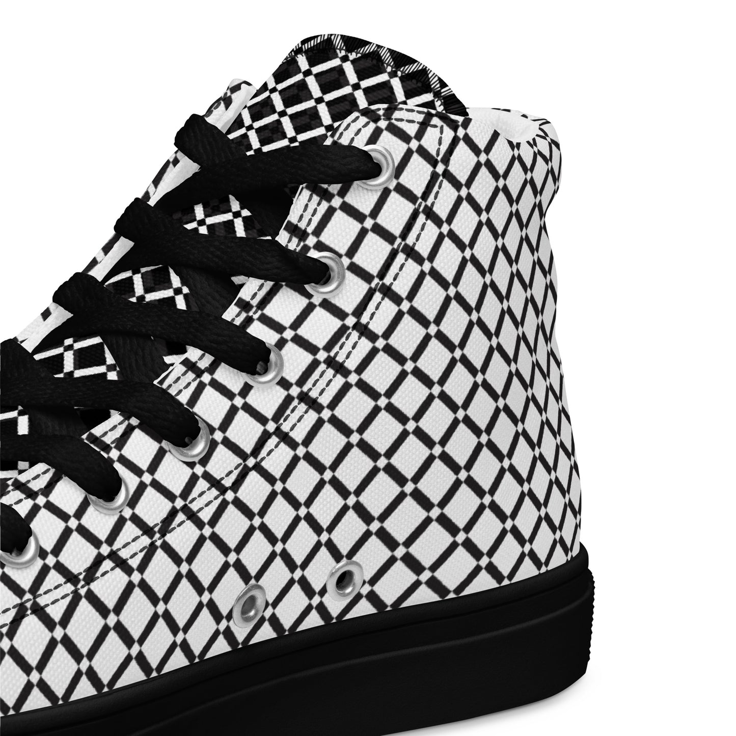 Close-up of women's black and white geometric high-top sneaker with black laces and lattice pattern