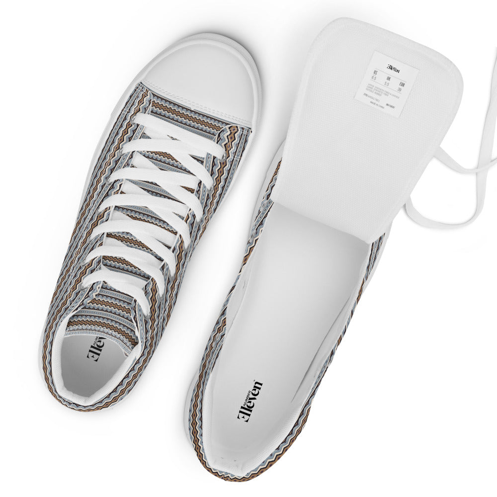 Top view of women’s high-top canvas sneakers with layered blue-gray, cream, brown, and black zigzag pattern and white laces