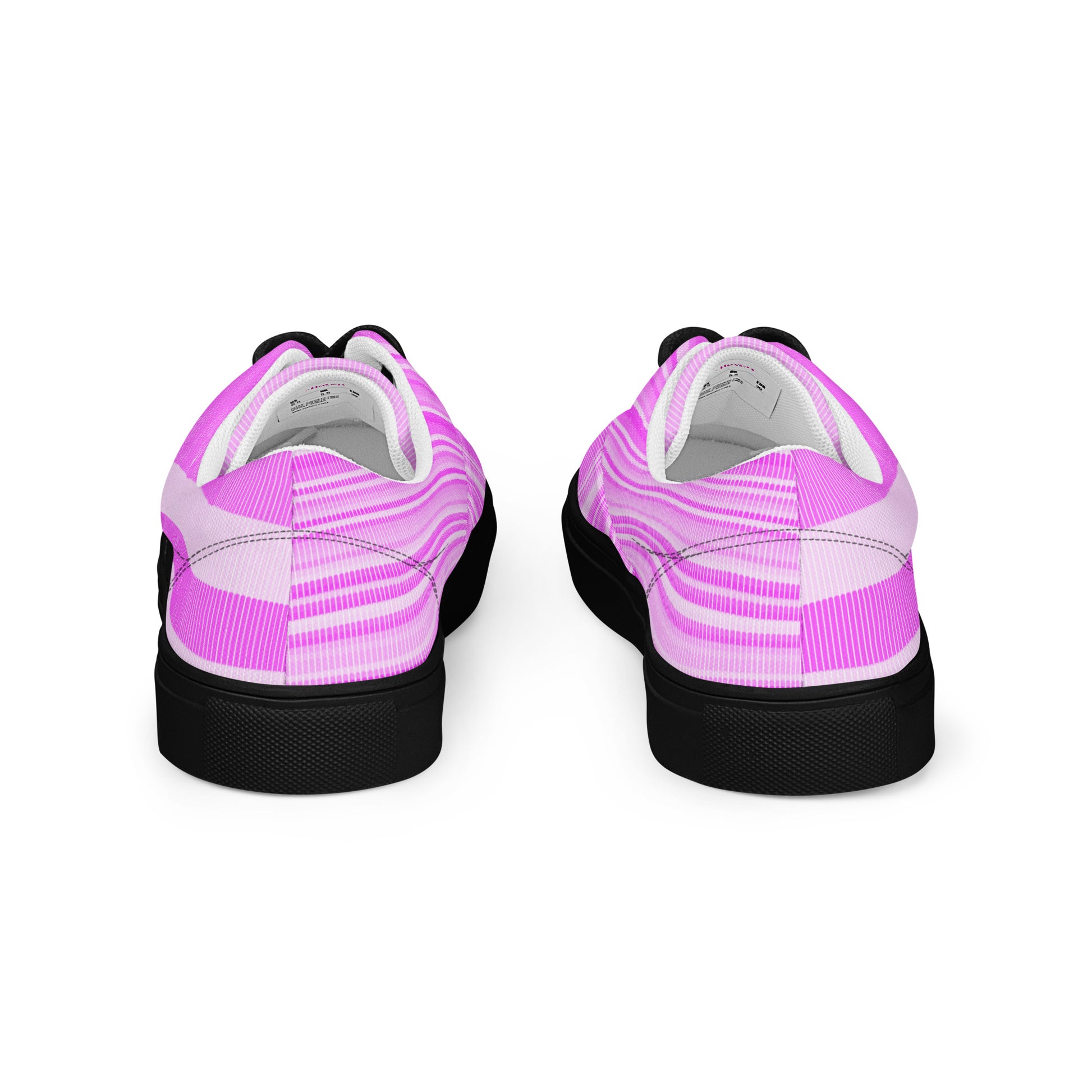 Back view of women’s lace-up canvas shoes with black sole featuring pink linear stripe pattern and soft pale pink heel bands