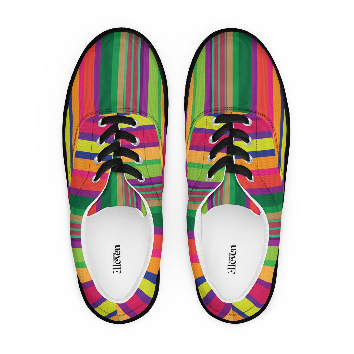 Top view of women’s lace-up canvas shoes with black laces and bold rainbow stripe design