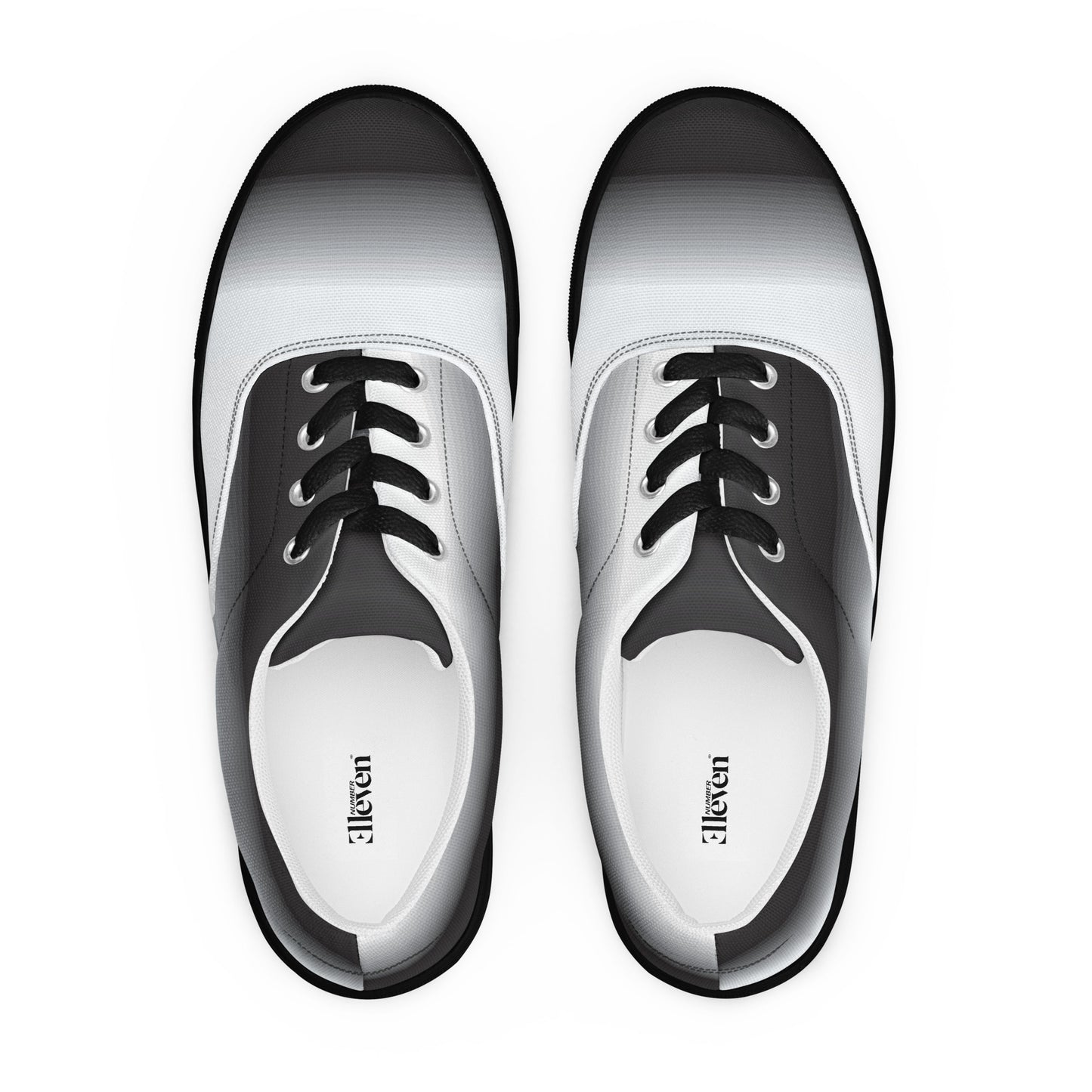 Top view of women’s lace-up canvas shoes with smooth
grayscale fade design and white laces