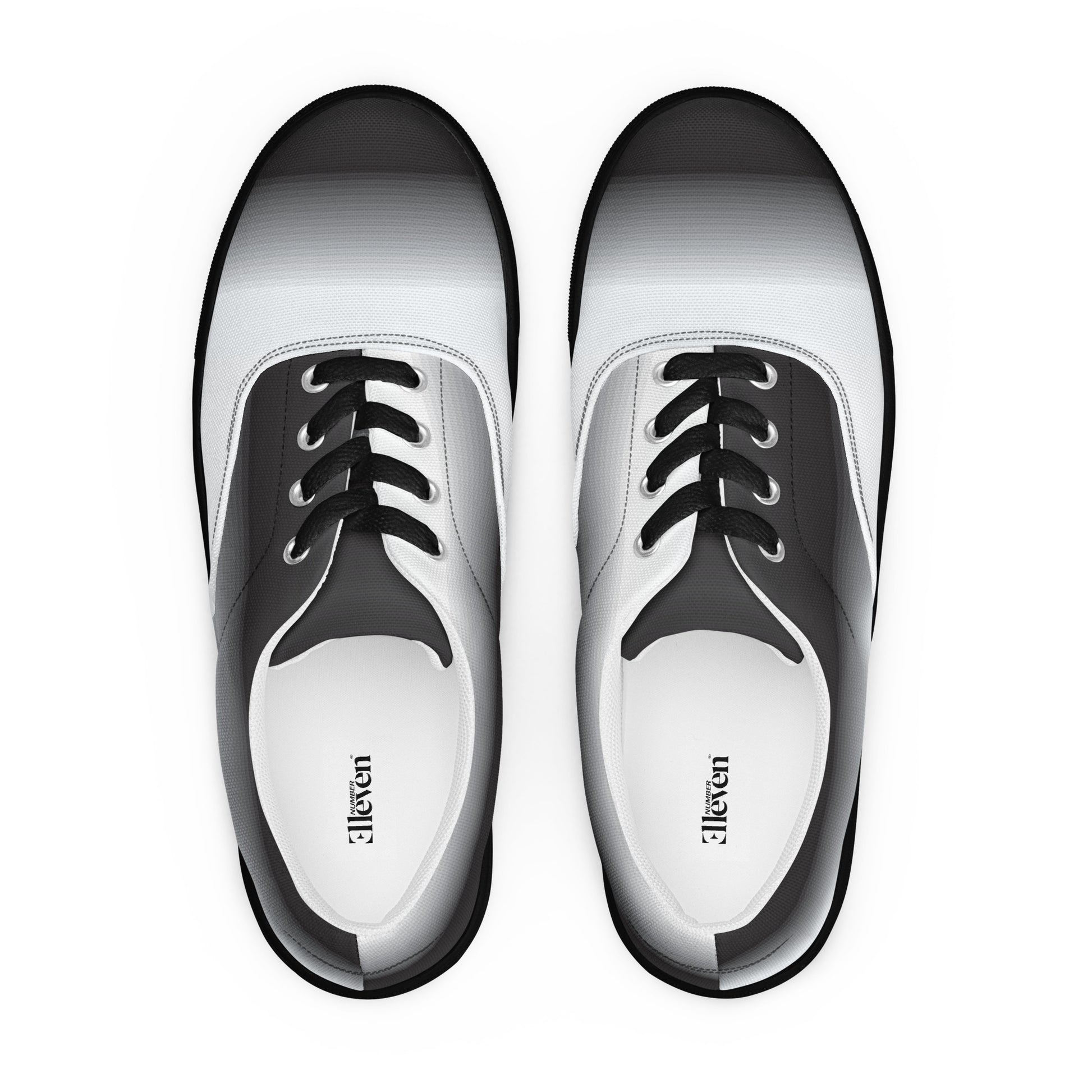 Top view of women’s lace-up canvas shoes with smooth
grayscale fade design and white laces