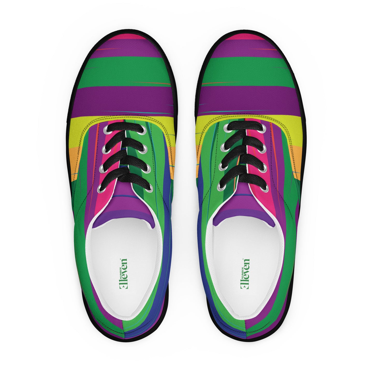 Top view of women’s lace-up canvas shoes with colorful curved stripe design, black laces, and black sole
