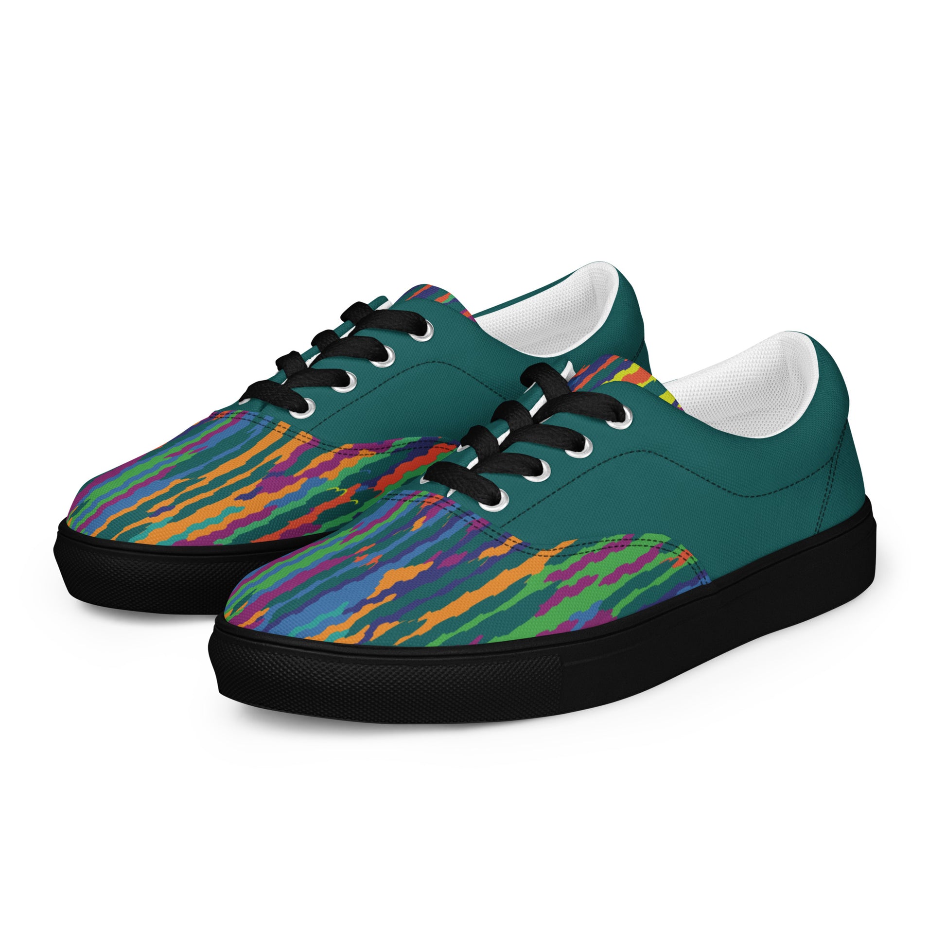 Women’s lace-up canvas shoes with teal upper, multicolor wave pattern on the front, black laces, and black sole