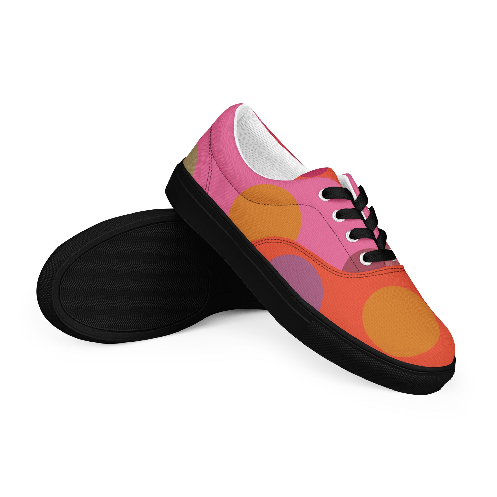 women’s lace-up canvas shoes with large geometric circles and warm retro colors, black sole pair view