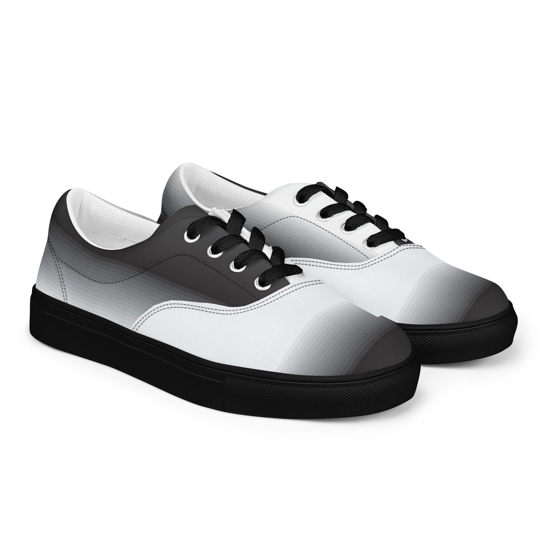 Women’s lace-up canvas shoes with monochrome gradient design,
black laces, and black sole
