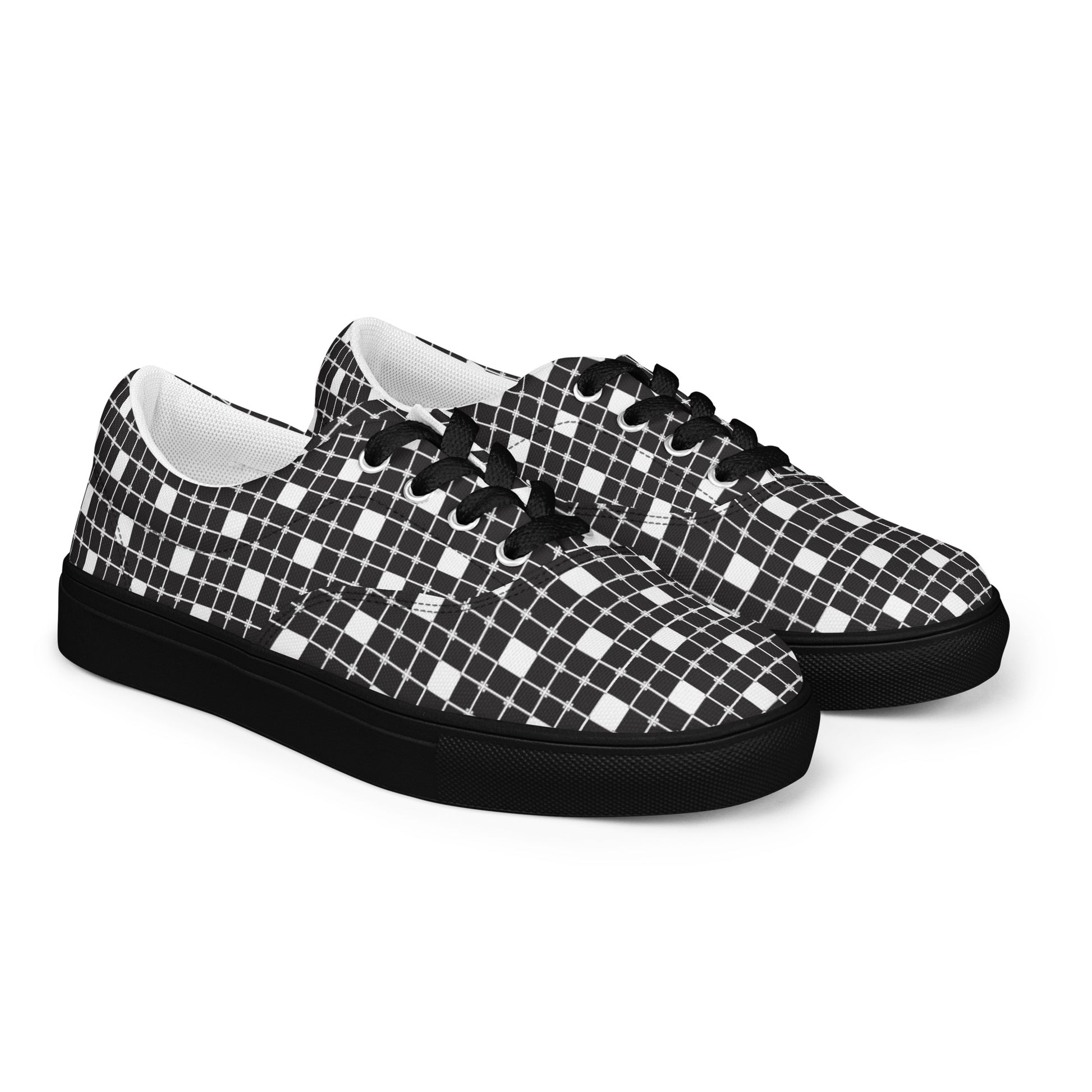 Women’s lace-up canvas shoes with black-and-white distorted grid pattern, black laces, and black sole, front view
