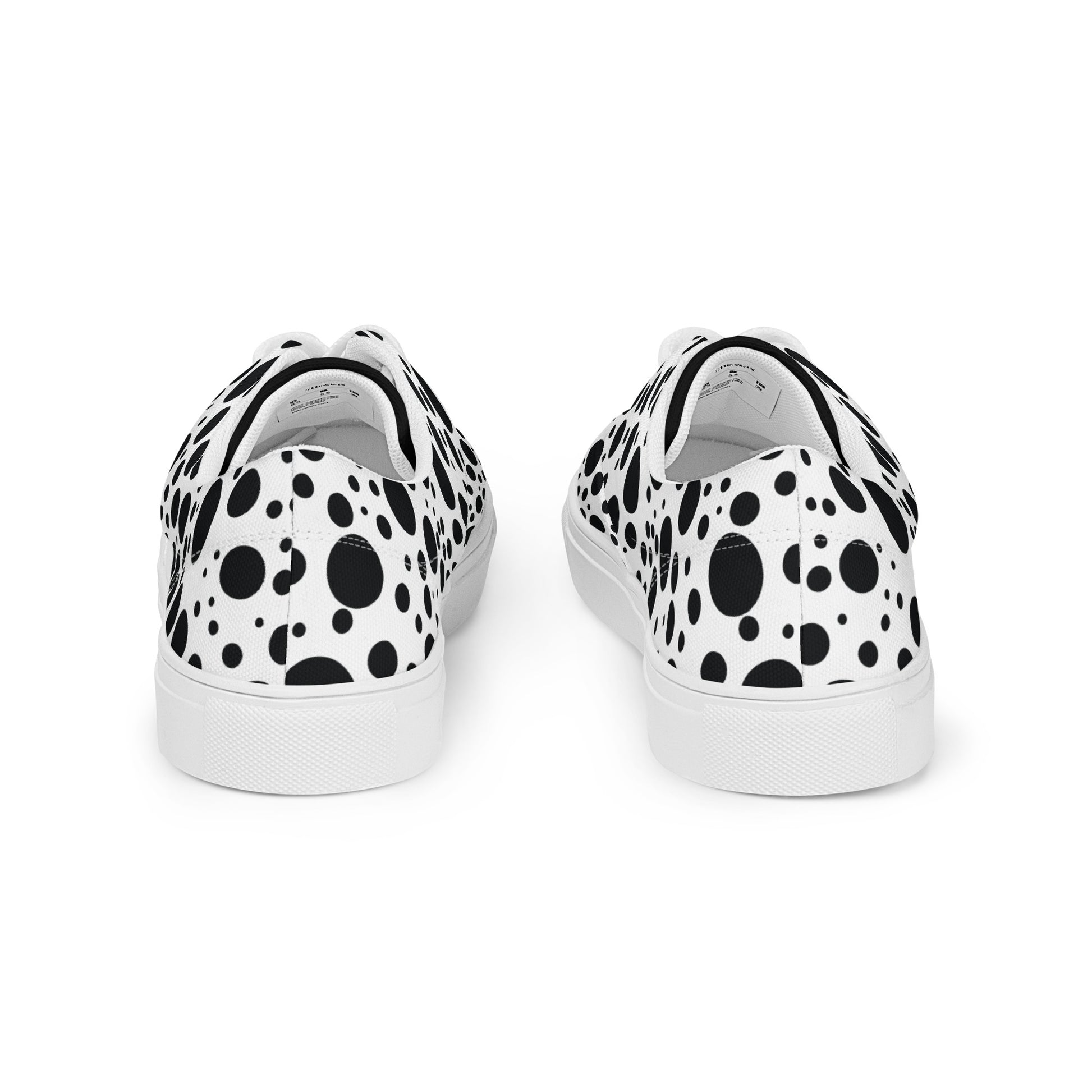 rear view of women’s lace-up canvas shoes with black polka dot design on white canvas