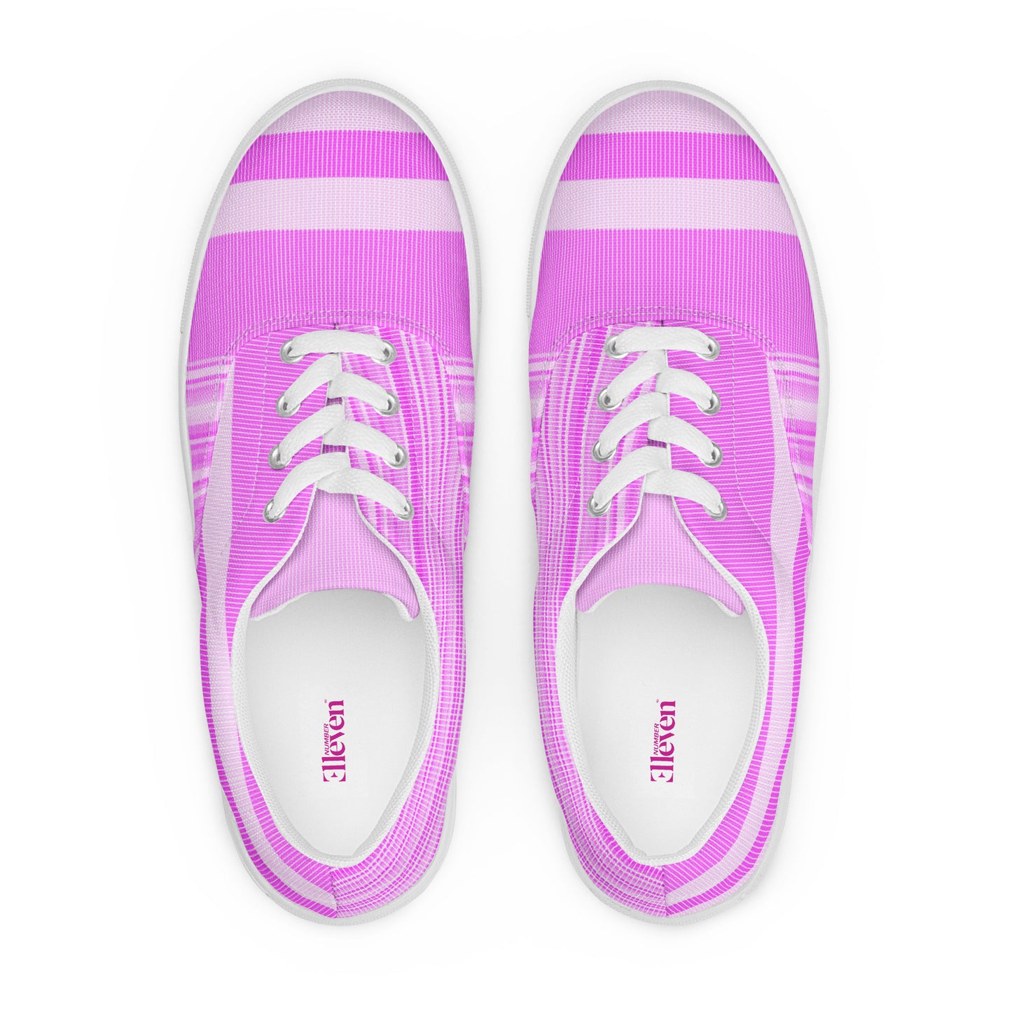 Top view of women’s lace-up canvas shoes in bright pink striped design with pale pink toe bands and white laces