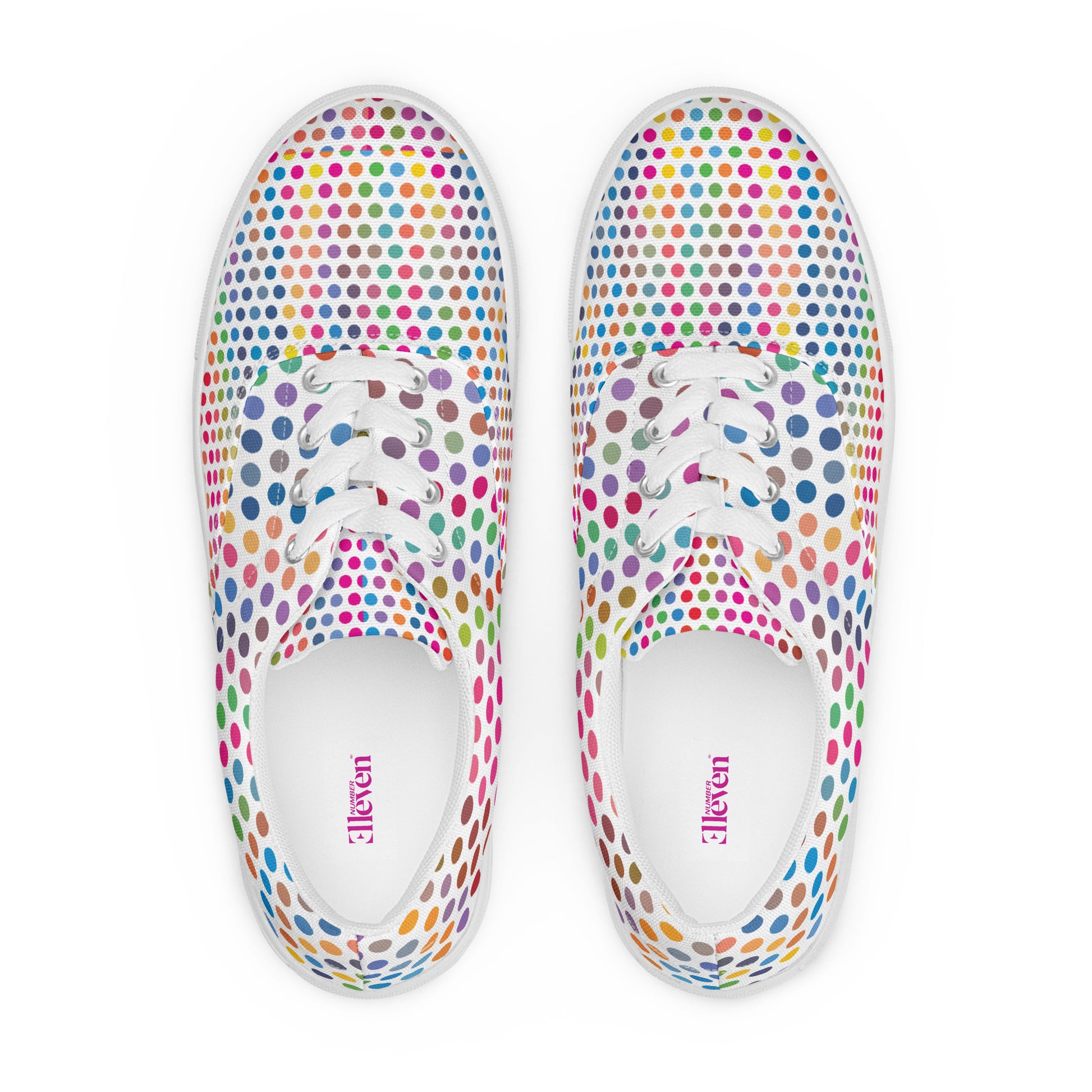 Top view of women’s lace-up canvas shoes with colorful dot grid pattern, white laces, and white base