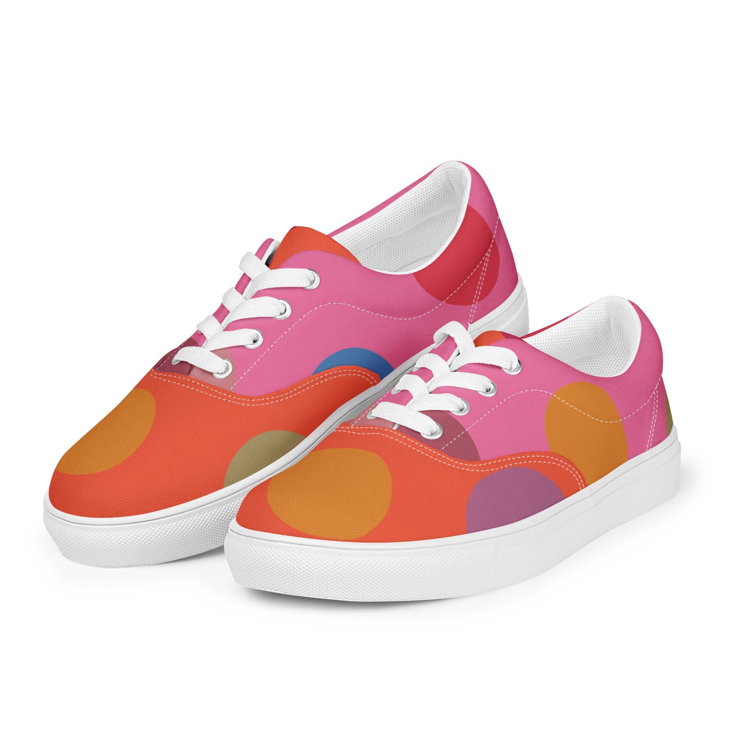 women’s lace-up canvas shoes with oversized dot pattern in pink, coral, orange, and lilac, white sole view