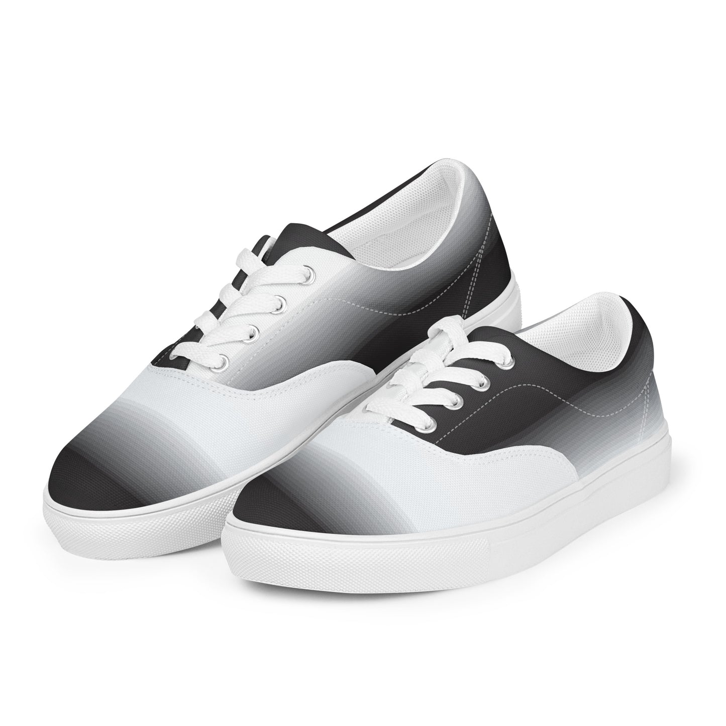 Angled side view of women’s lace-up canvas shoes with soft
black and white ombre pattern on white sole