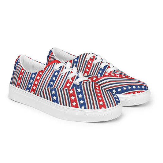 Front angled view of American star stripe women's lace-up canvas shoes with red white blue vertical pattern and white sole